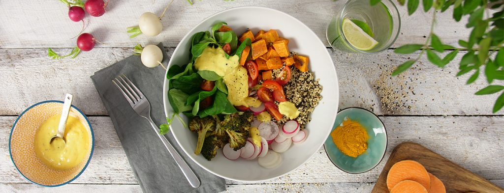 Colorful bowl with turmeric dressing